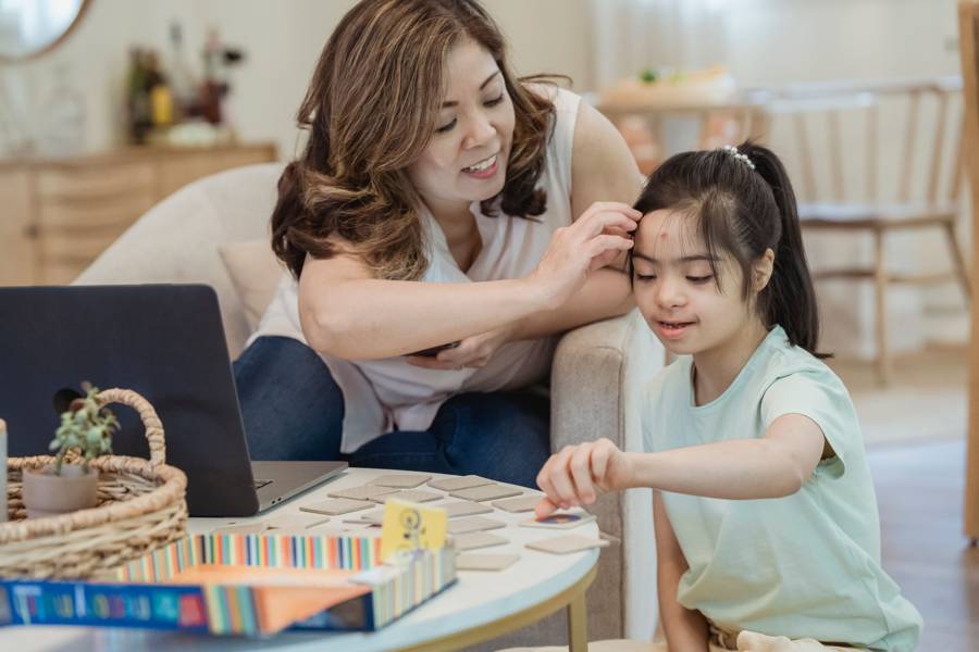 Mother playing a matching game with her daughter
